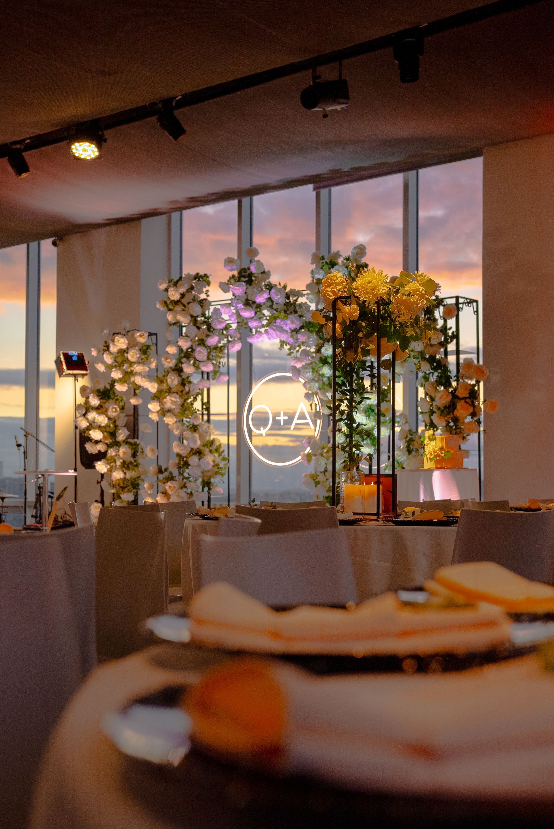 Snowy cityscape with buildings and a balcony.