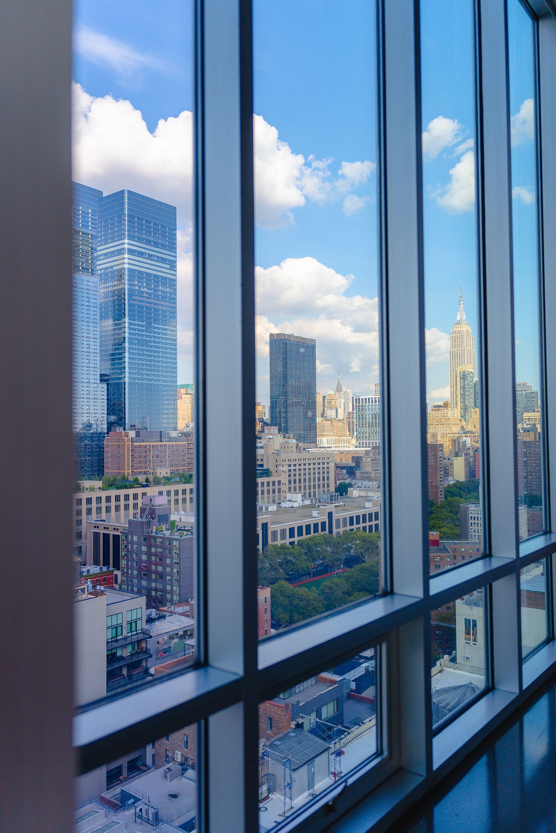 A view of a city through a large window.