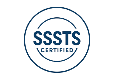 A dark blue, circular certification logo featuring the text 
