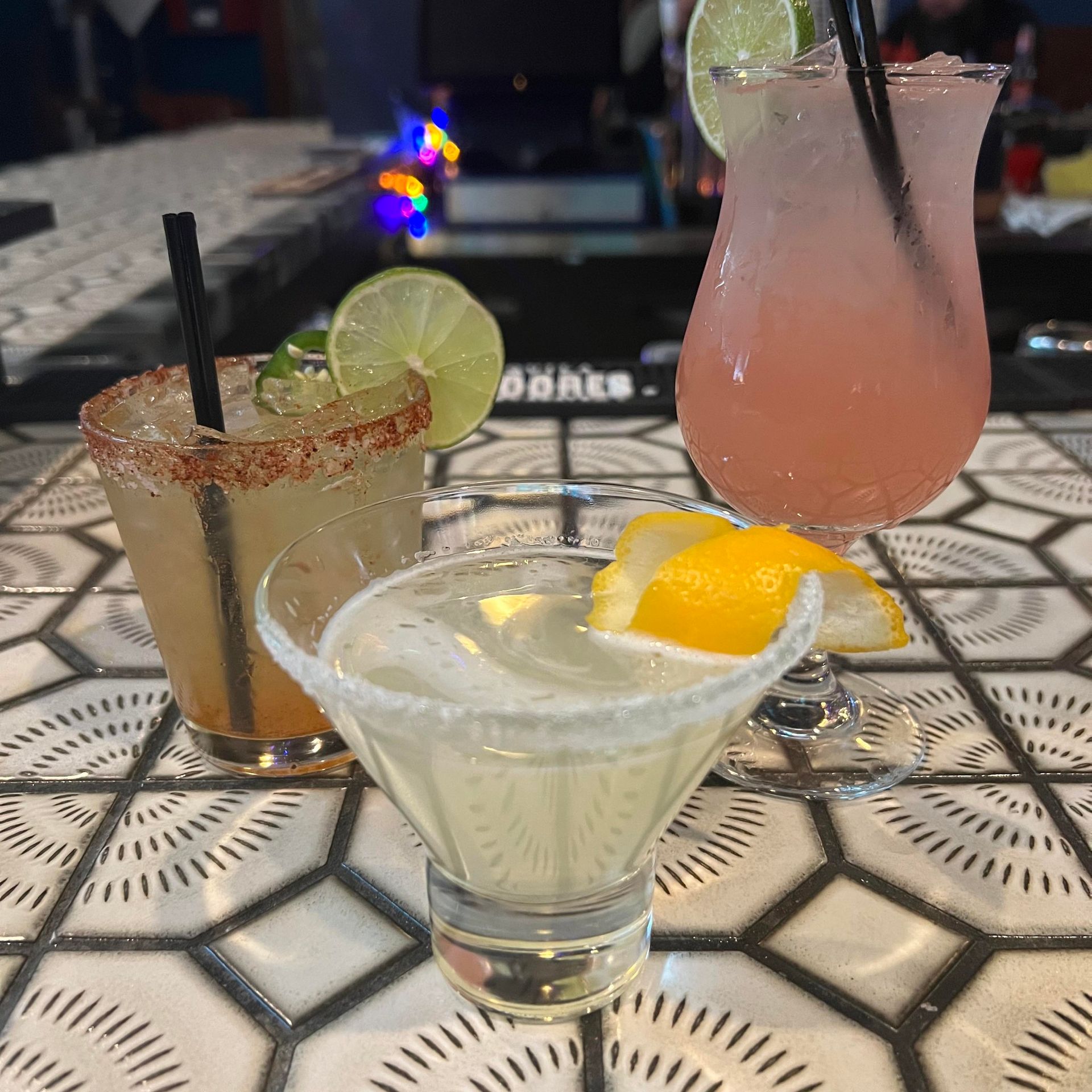 Three different types of drinks are sitting on a table.