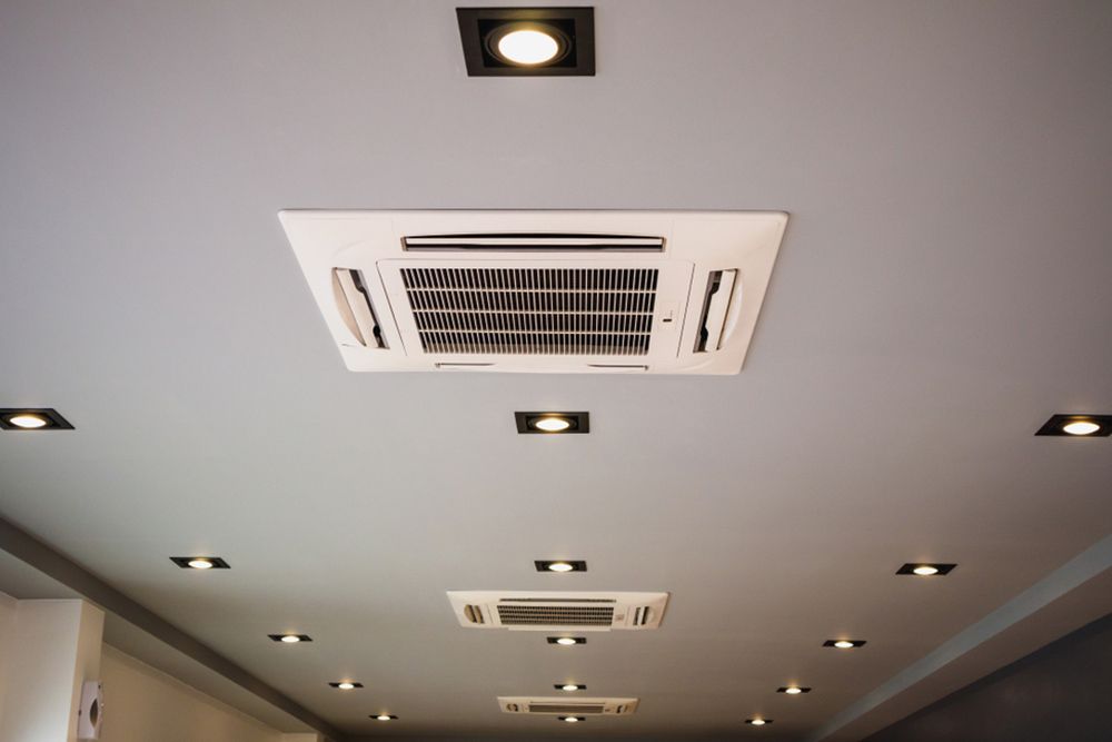 Office modern ceiling cassette type aircon — Air Conditioning Installation in Tamworth, NSW