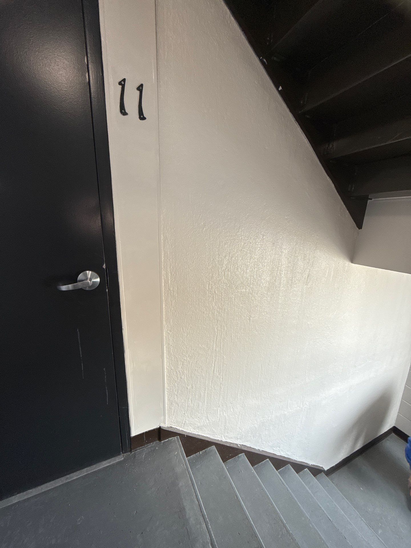 A staircase with the number 11 on the wall