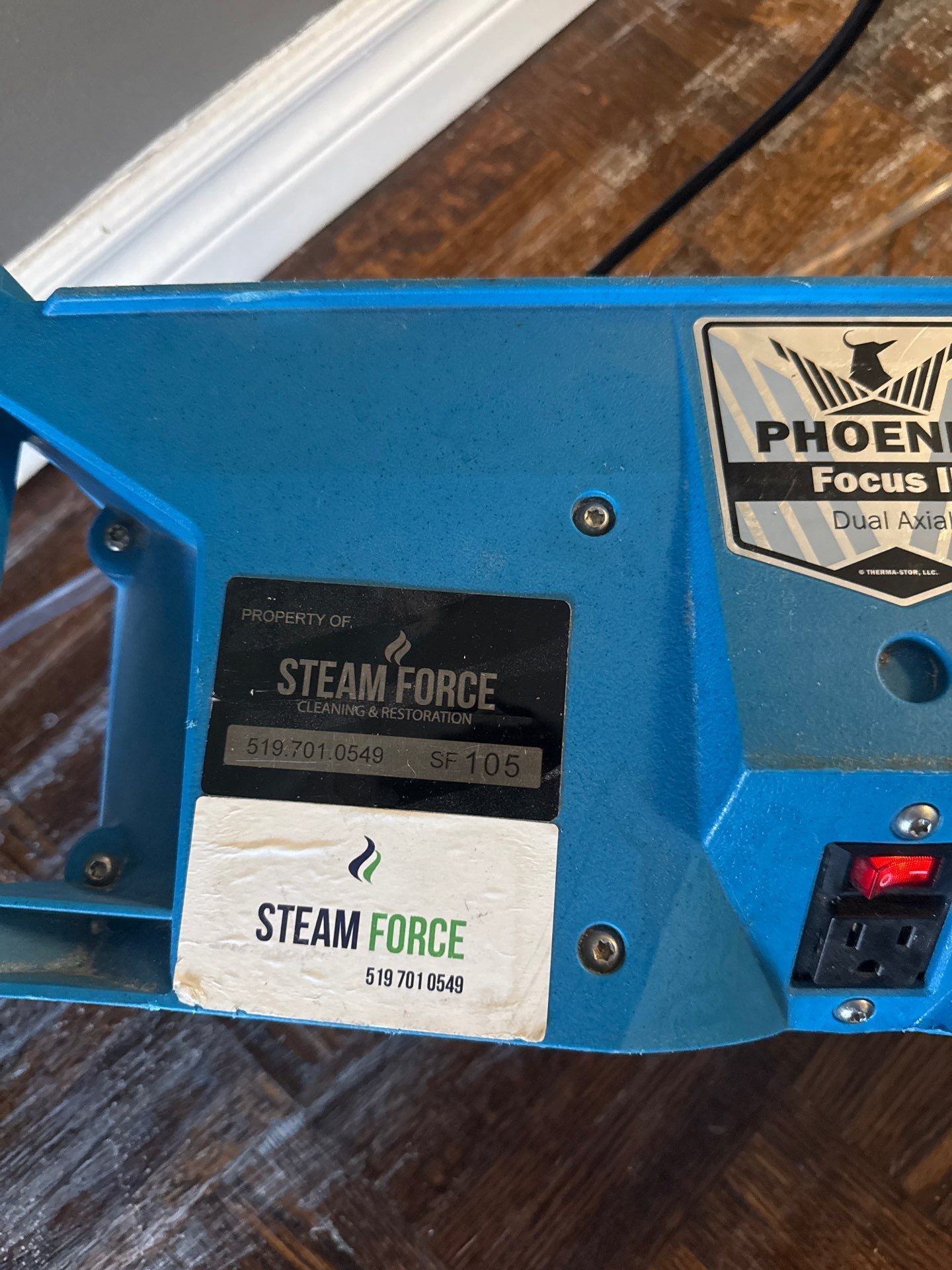 A blue machine with a label that says steam force on it