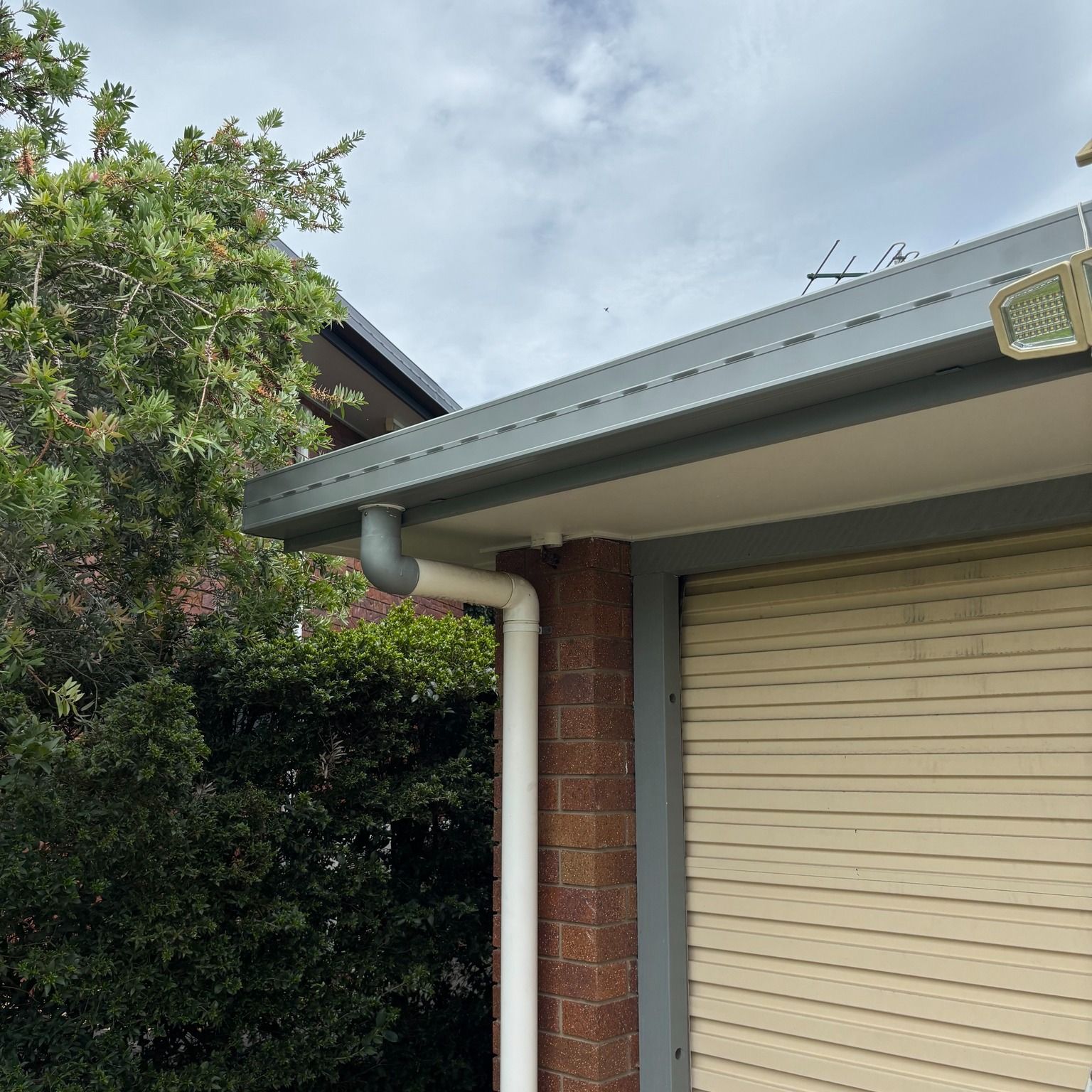 A Tiled Shower Wall With a Horizontal Strip of Mosaic Tiles — Mates Plumbing and Gas in Lammermoor, QLD