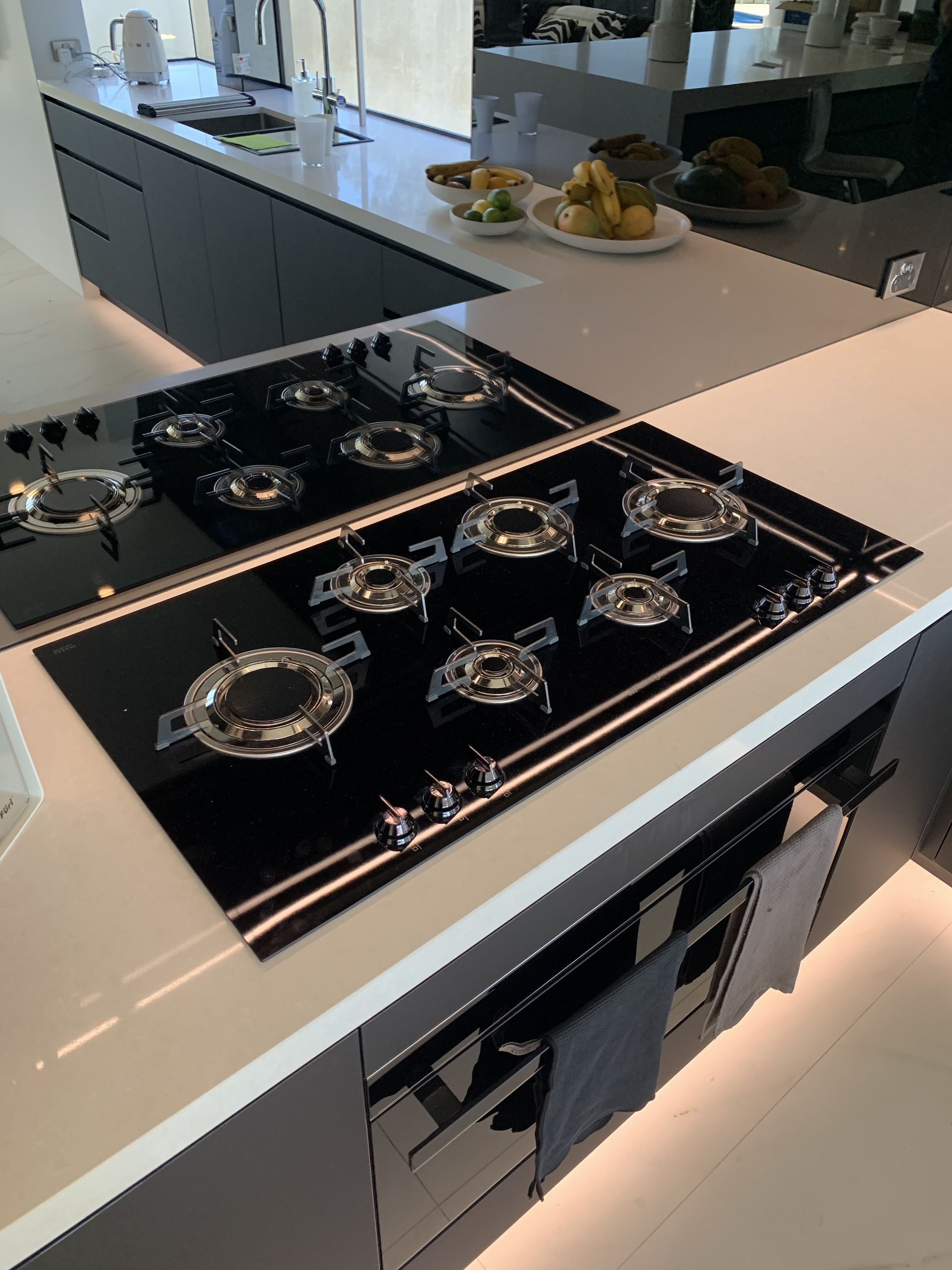 A Small White Thermann Water Heater Sits on a Tray — Mates Plumbing and Gas in Lammermoor, QLD