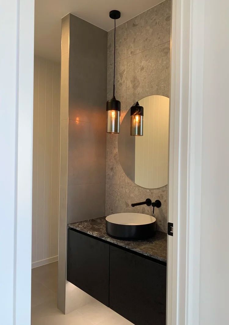 Modern Bathroom Vanity With a Black Cabinet, Speckled Countertop — Mates Plumbing and Gas in Lammermoor, QLD