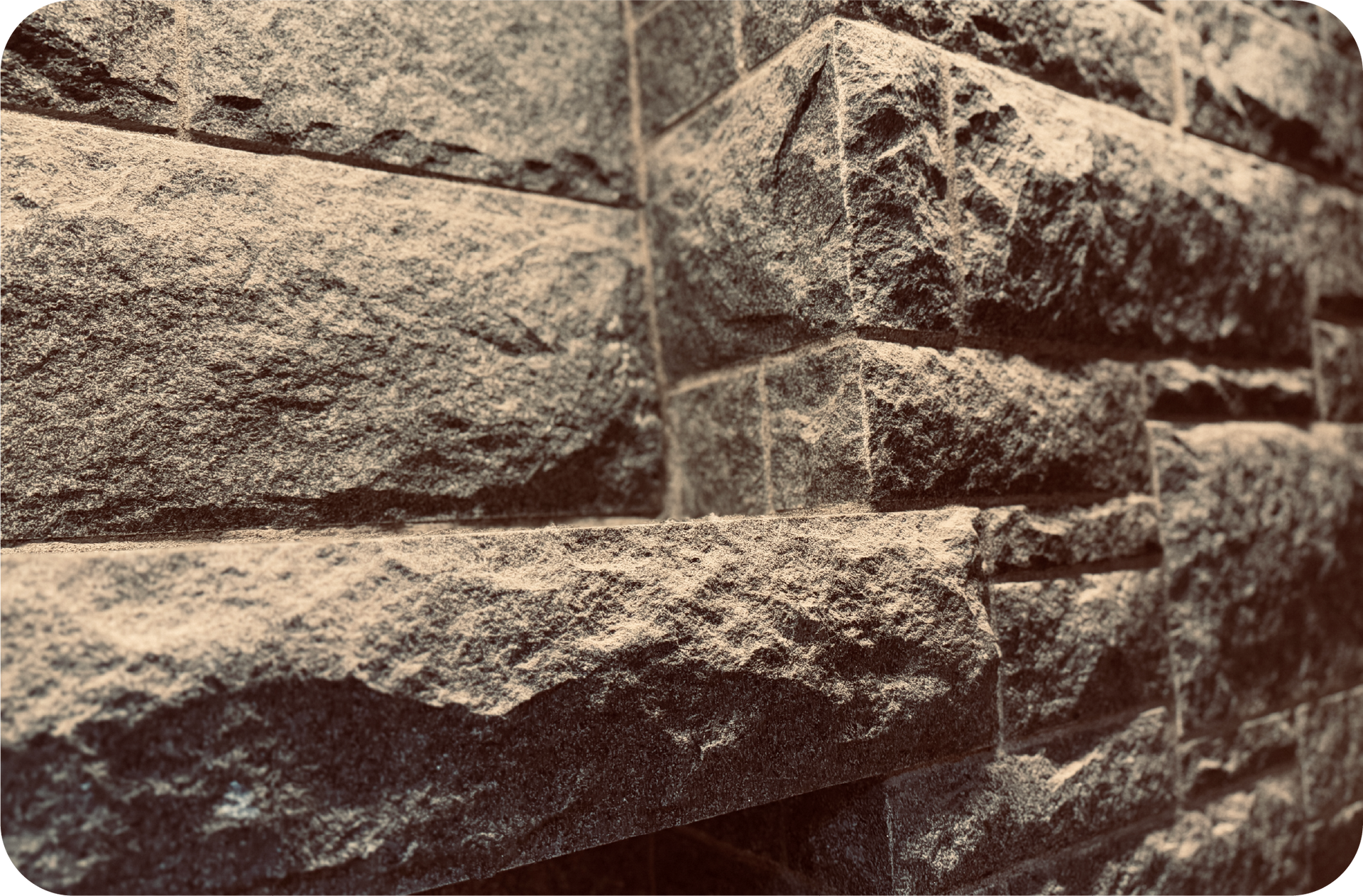 A black and white photo of a stone wall.