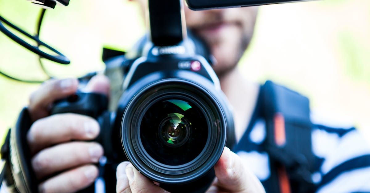 A man is taking a picture with a camera.