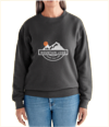 a woman is wearing a black sweatshirt with a mountain and sun on it .
