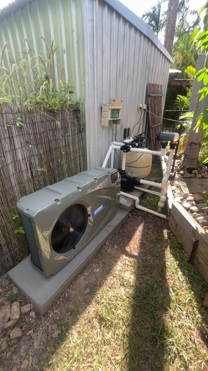 A Woman is Holding a Green Recycling Bin in a Living Room — Friendly Pool & Spa Care in Coconut Grove, NT 