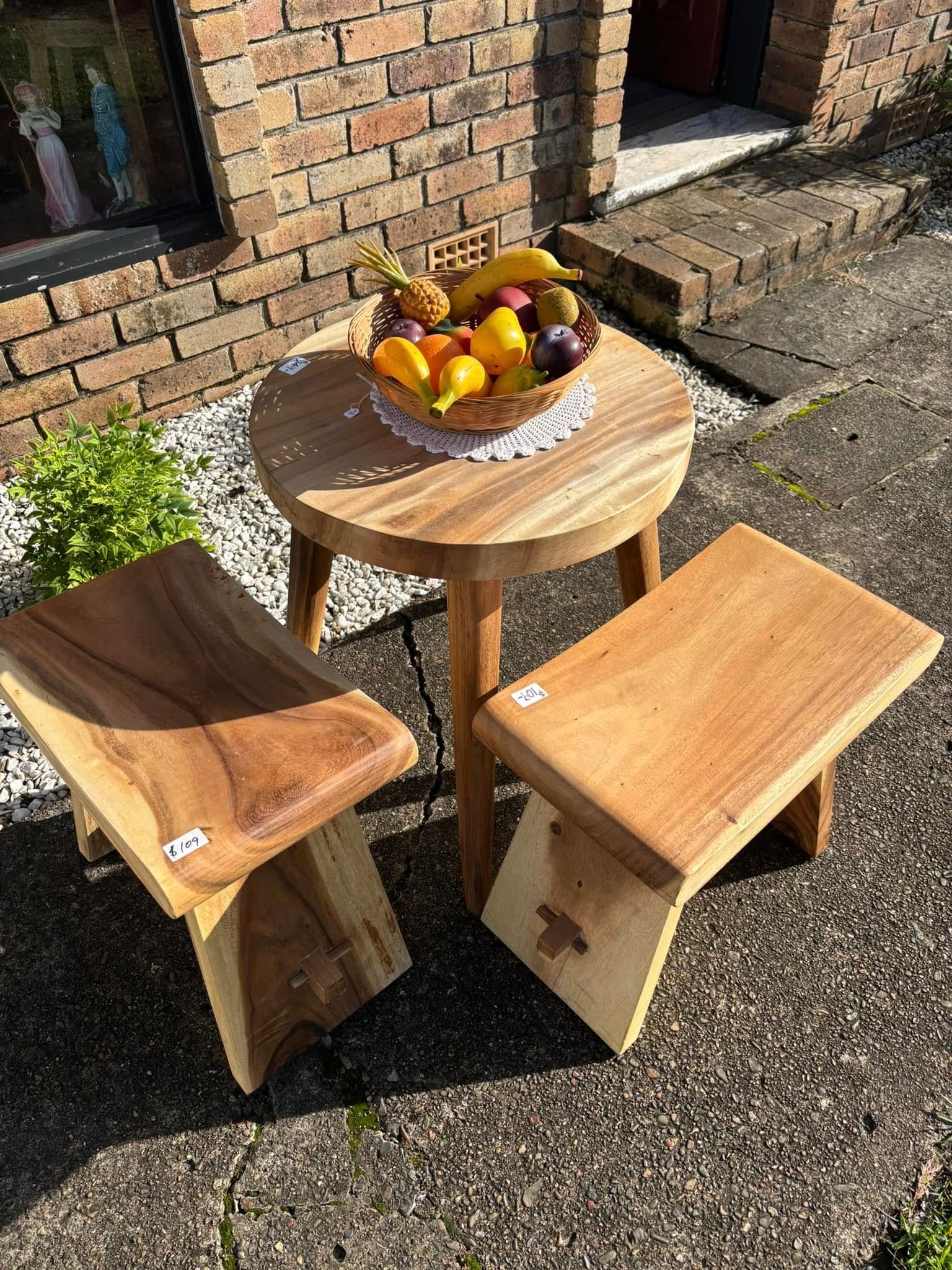 Wooden table and two stools set outside with fruit basket — Clancy's Office & Emporium in Taree, NSW
