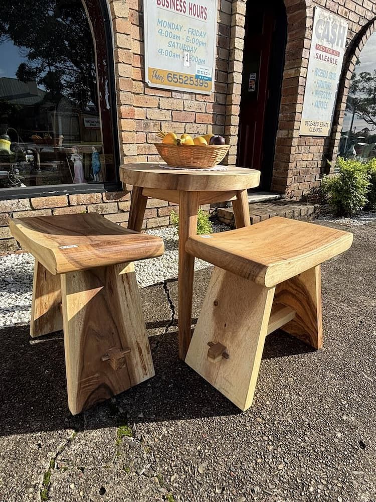 Wooden Stools and a Small Table Sit Outside a Brick Building — Clancy's Office & Emporium in Taree, NSW
