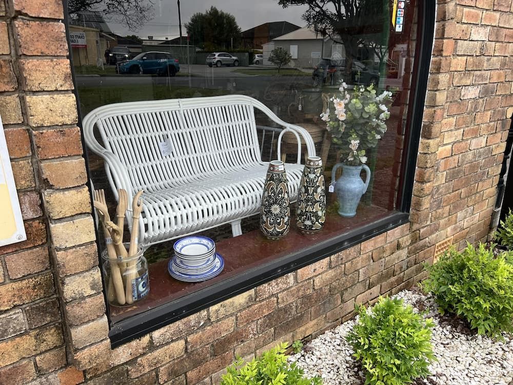 Window Display Featuring a White Wicker Bench — Clancy's Office & Emporium in Taree, NSW