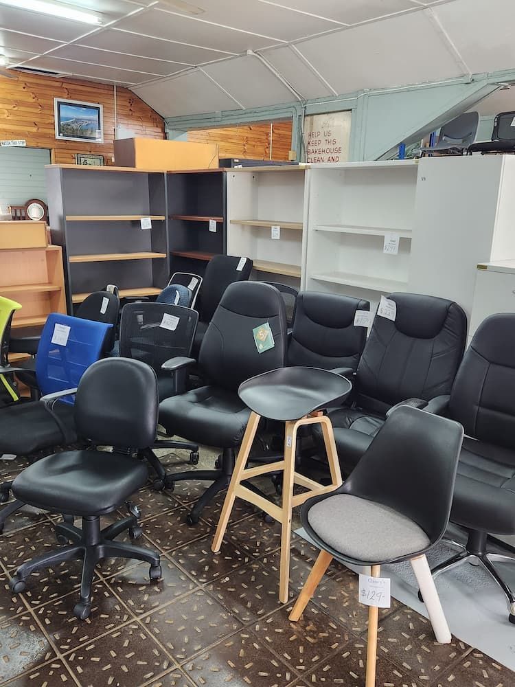 A Showroom With Used Office Furniture Including Chairs and Bookshelves — Clancy's Office & Emporium in Taree, NSW