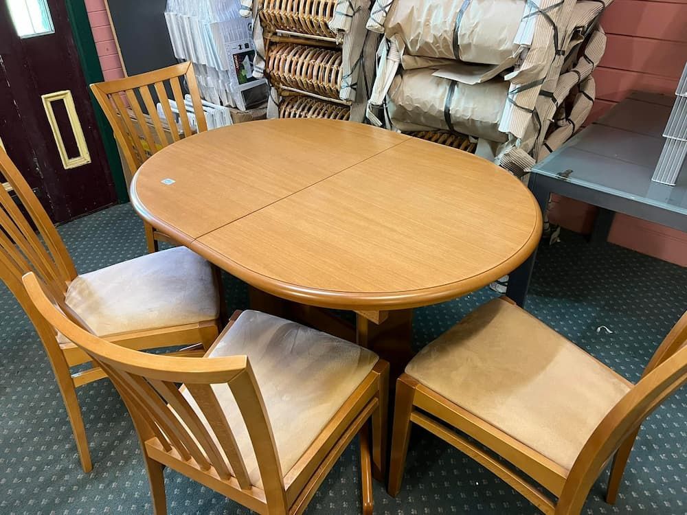 A Light Wood Dining Table With Four Matching Chairs — Clancy's Office & Emporium in Taree, NSW