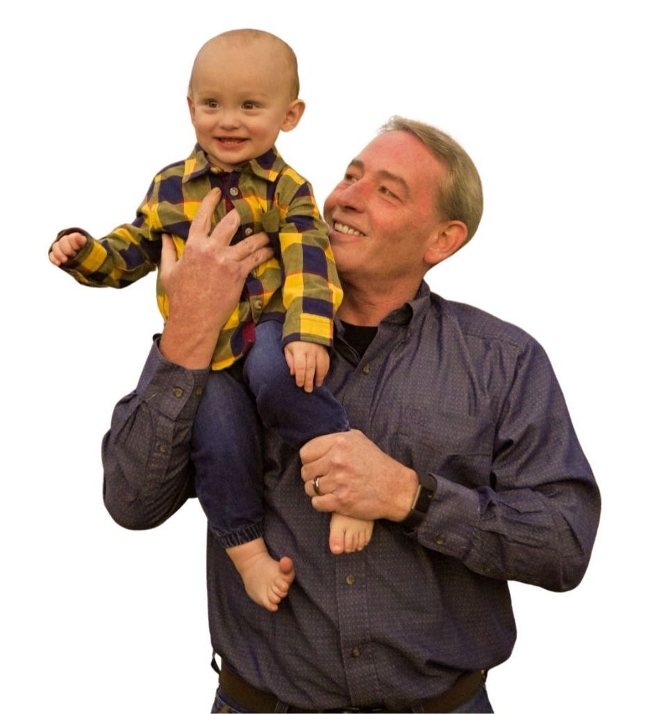 photo of Todd Hayes of hayes digital marketing holding his son