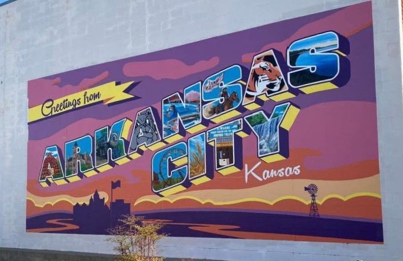 Ark City Kansas downtown mural A mural on a wall in downtown Ark City that says arkansas city kansas
