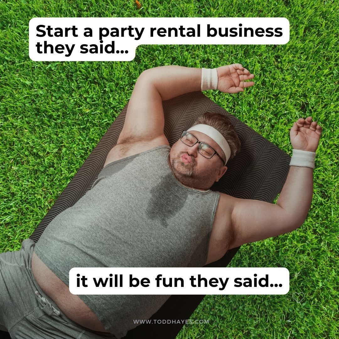 A man is sweating while laying on a yoga mat in the grass.