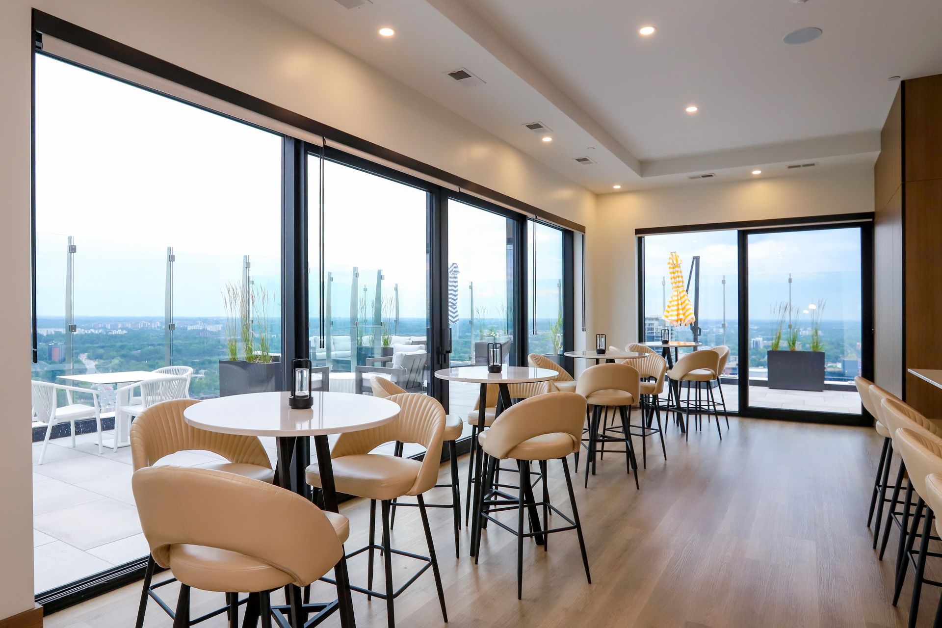 Lounge at Aqui on King.  Located on the 33rd floor for residents and their guests featuring a stunning space with oversized windows and doors for an ambience and view like no other!