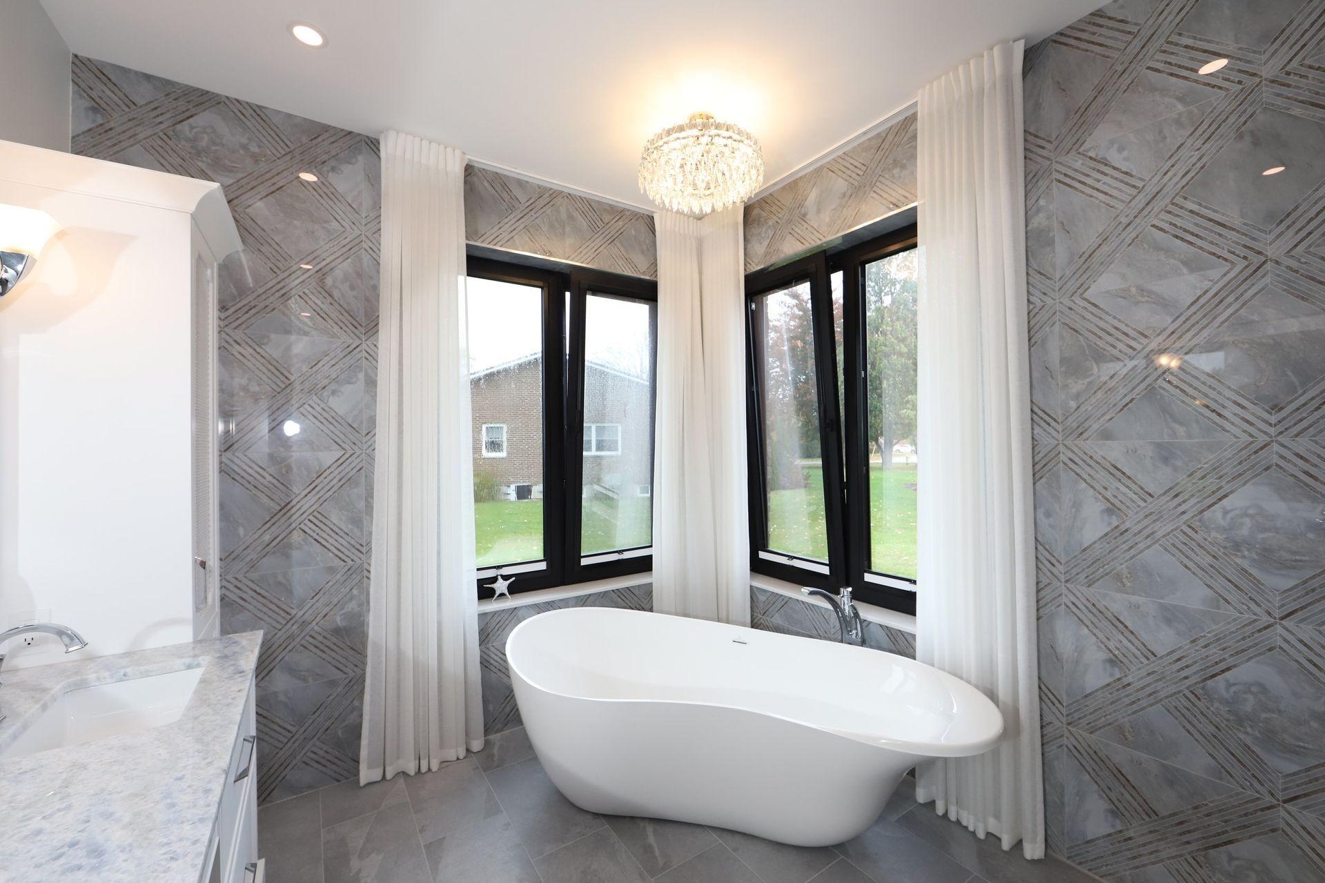 There is a bathtub in the middle of the bathroom.