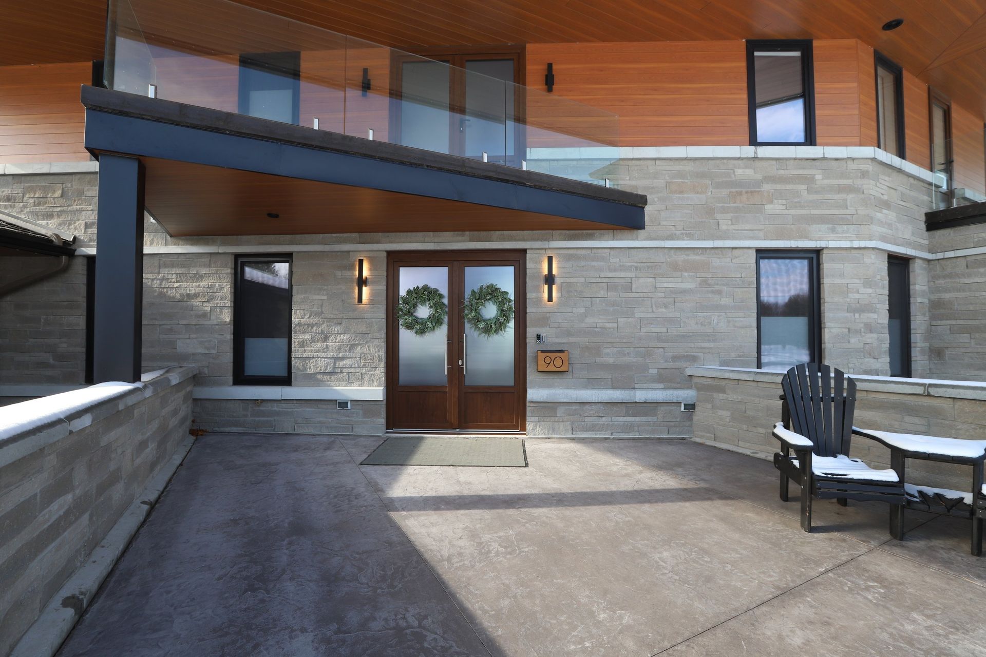 The front door of a house with a wreath on it
