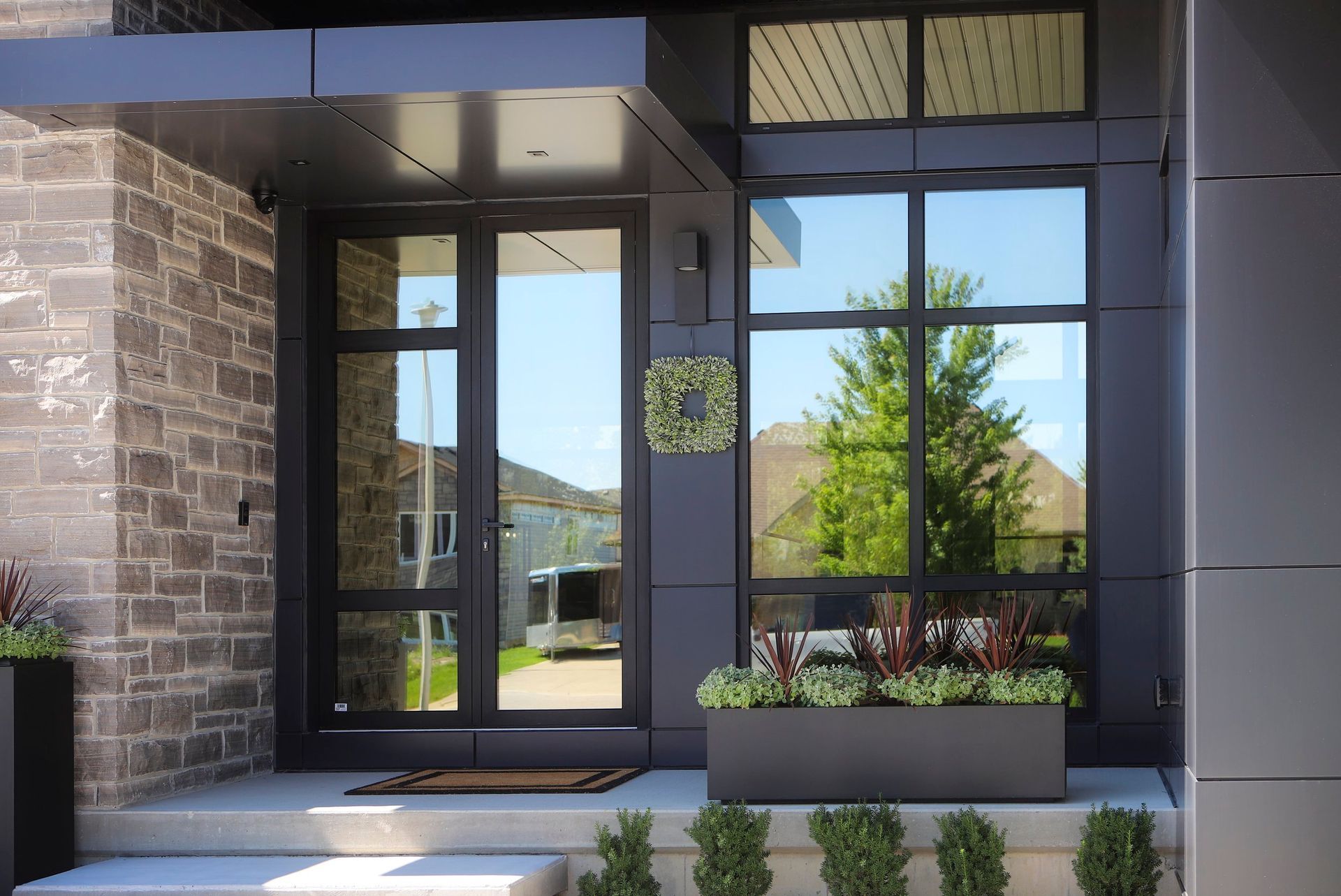 The front door of a house has a wreath on it