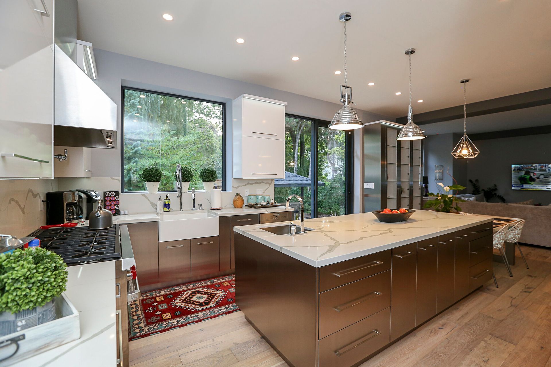 A kitchen with stainless steel cabinets and a large island.