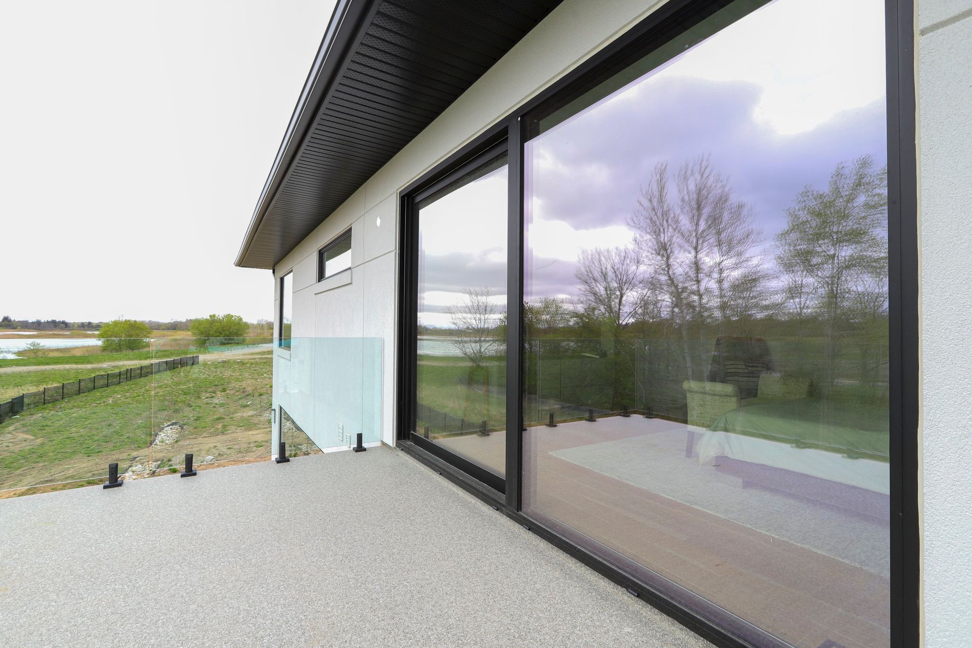 A large sliding glass door on the side of a house.