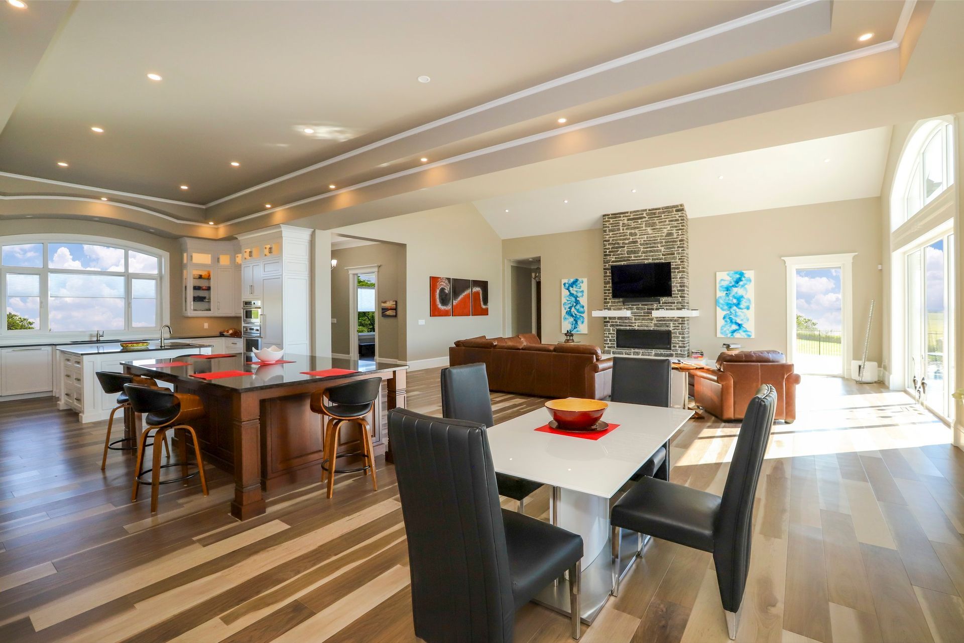 There is a table and chairs in the middle of the room.