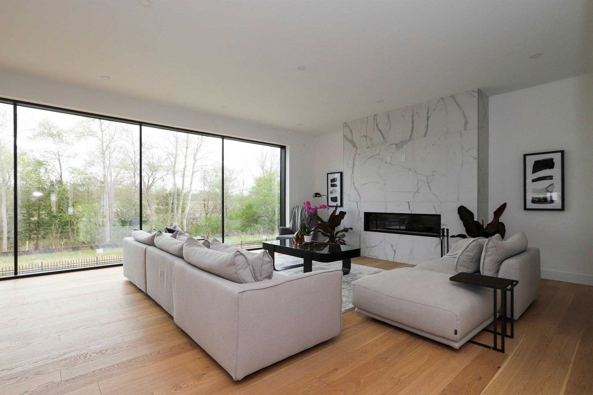 A living room with a large couch and a fireplace