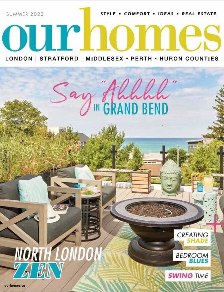 The cover of our homes magazine shows a patio with chairs and a fire pit.
