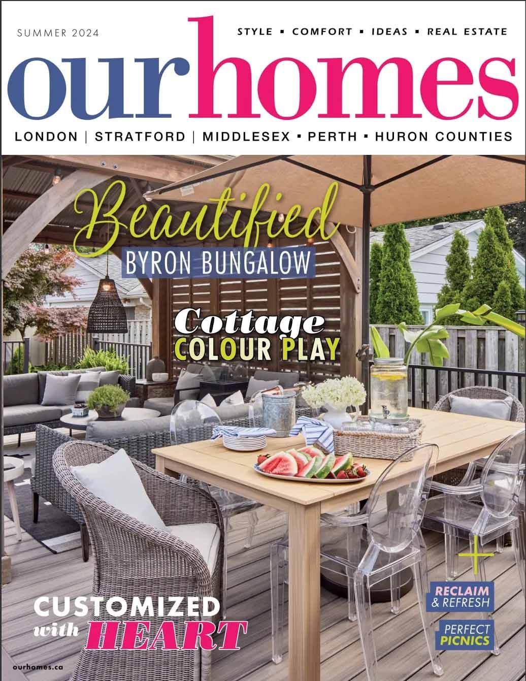 The cover of our homes magazine with a table and chairs on it.