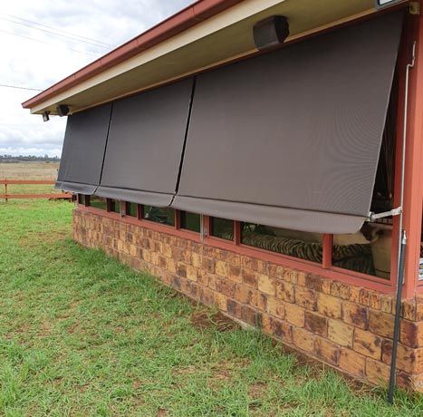 Contemporary Awnings on Brick House