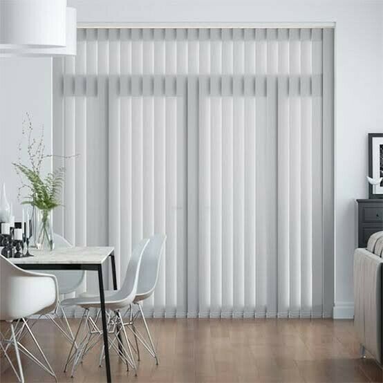 Window With White Vertical Blinds