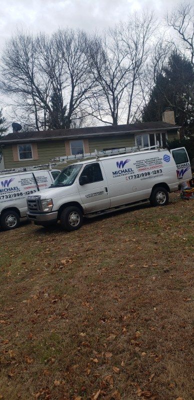 A bathroom with a bathtub , sink , and mirror.
