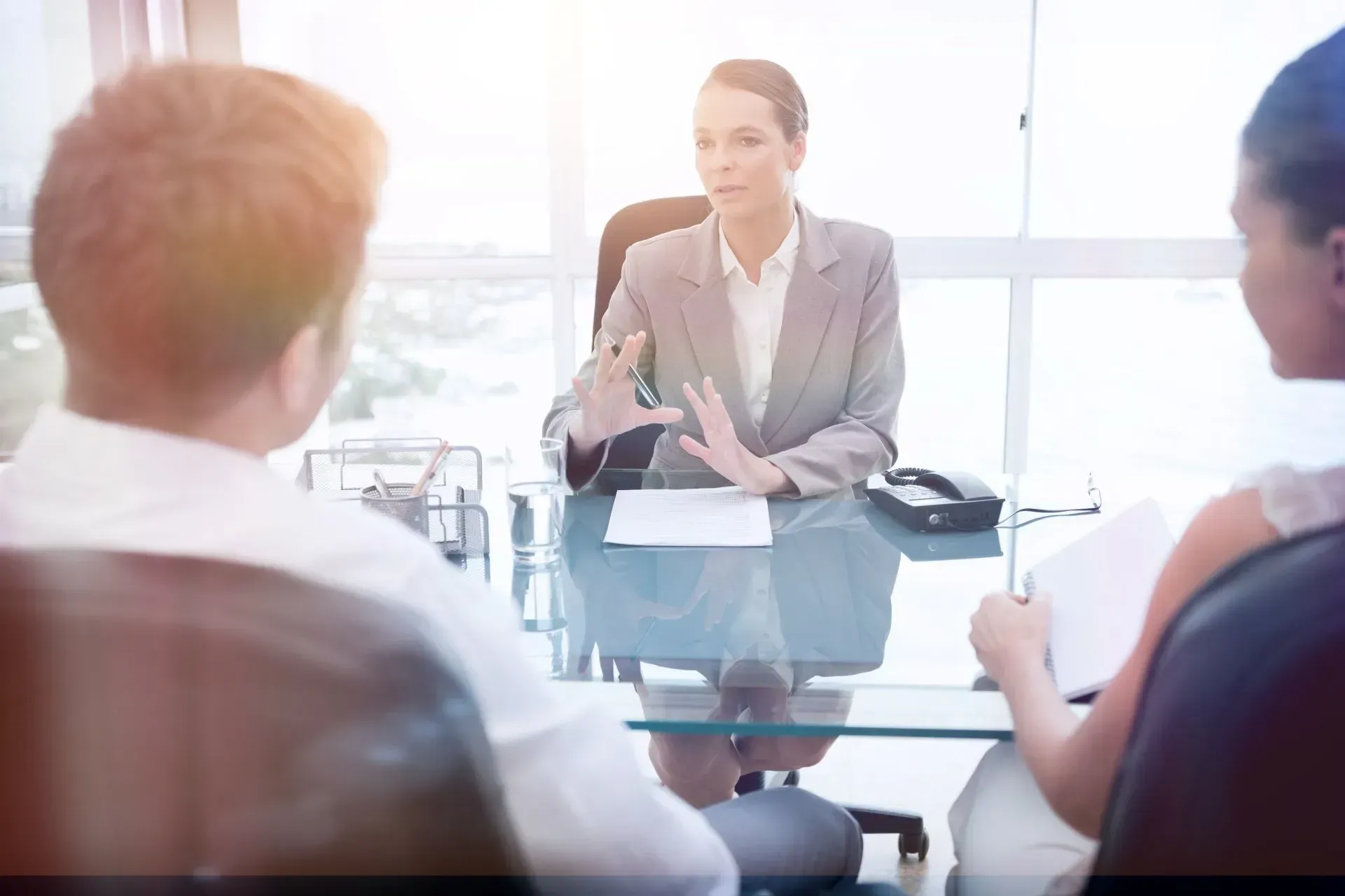 a solicitor talking to her clients