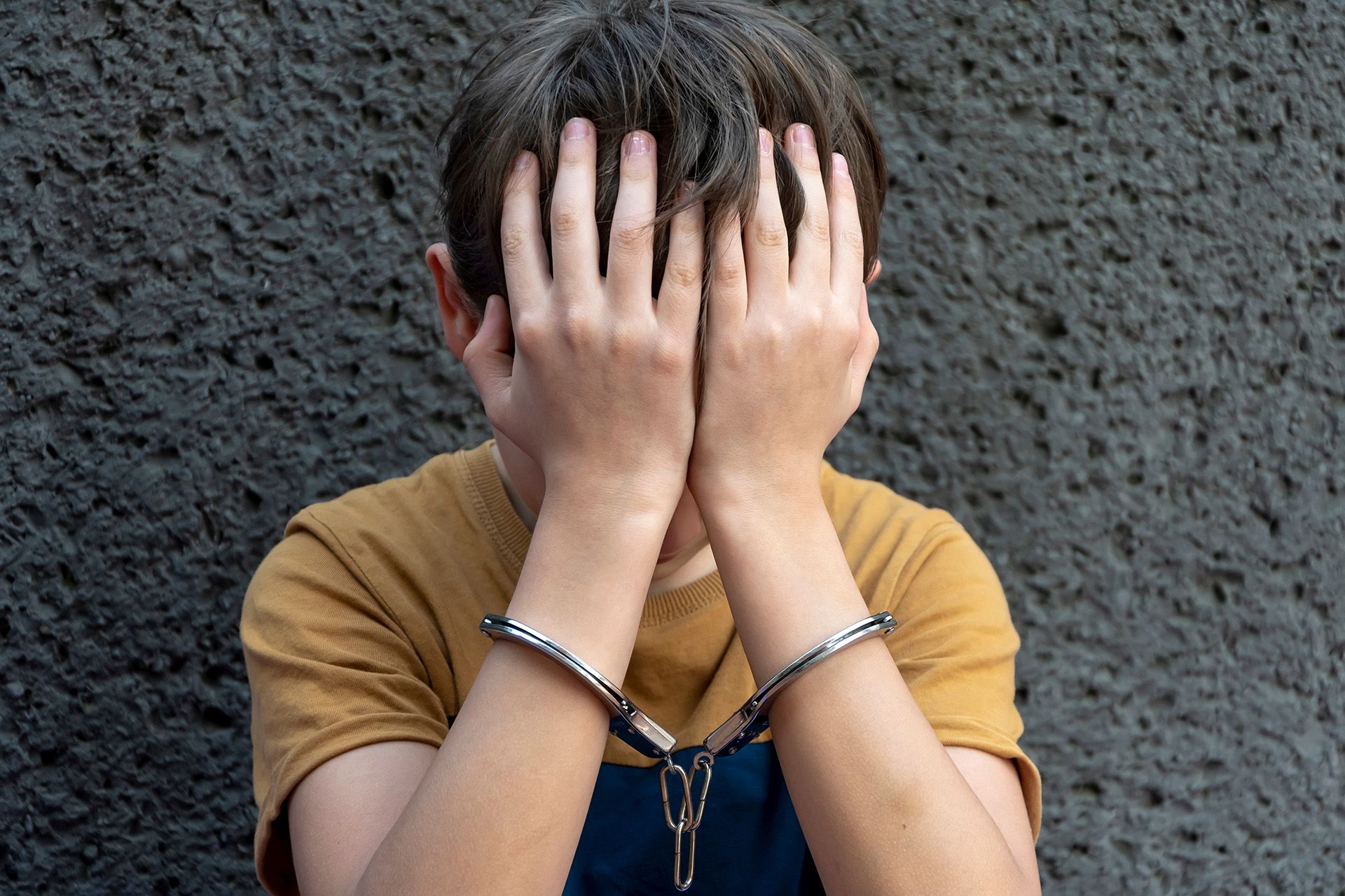 a child in handcuffs