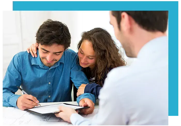 a couple signing a document