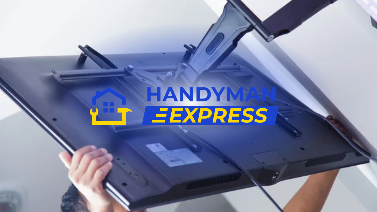TV mount installation by HandyMan Express, with gloved hands holding a black flat-screen bracket.