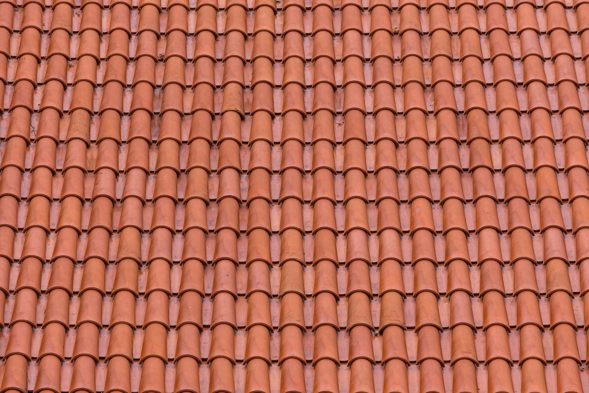 Red clay roof tiles arranged in rows