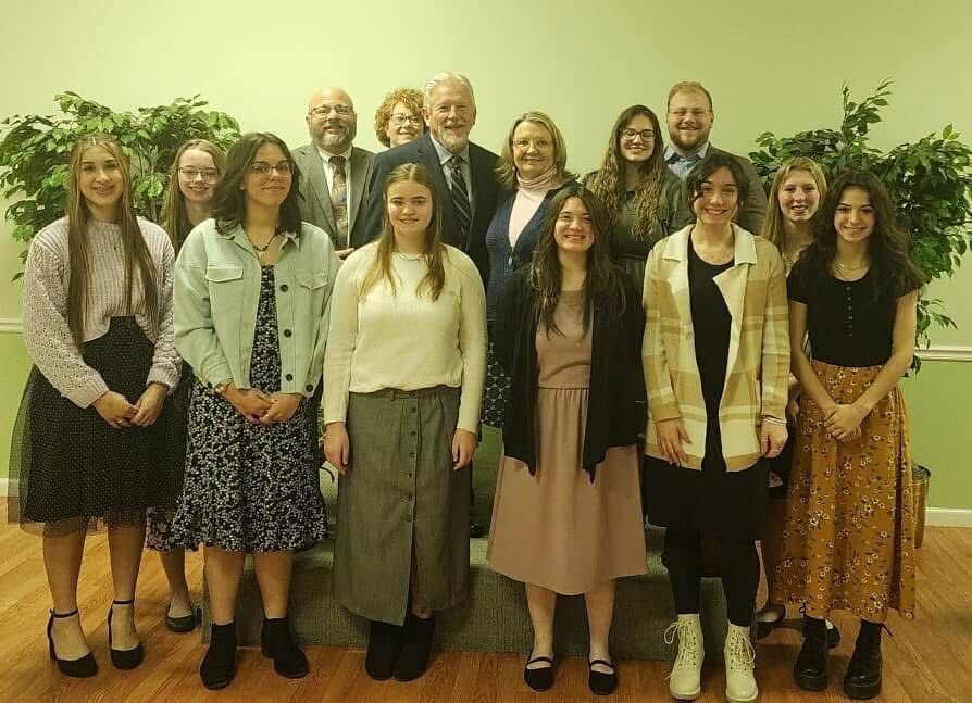 A group of people are posing for a picture together.