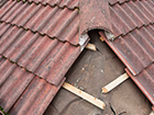 a close up of a roof with a hole in it .