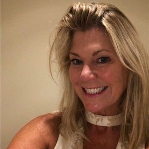 Gray silhouette of a person in a circle, representing a placeholder for a profile picture.