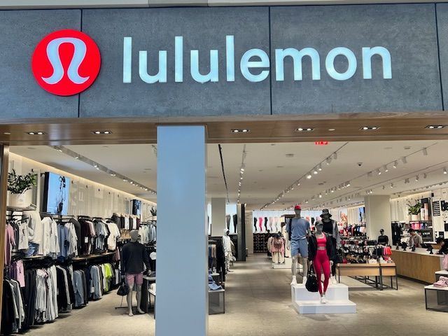A lululemon store with mannequins in front of it