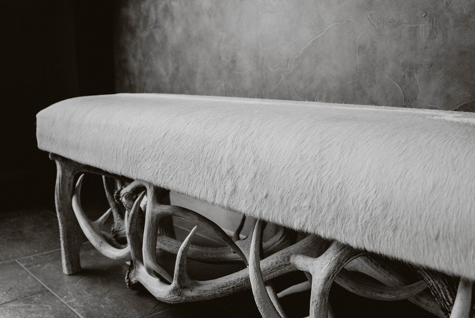 Antler and hide piano bench
