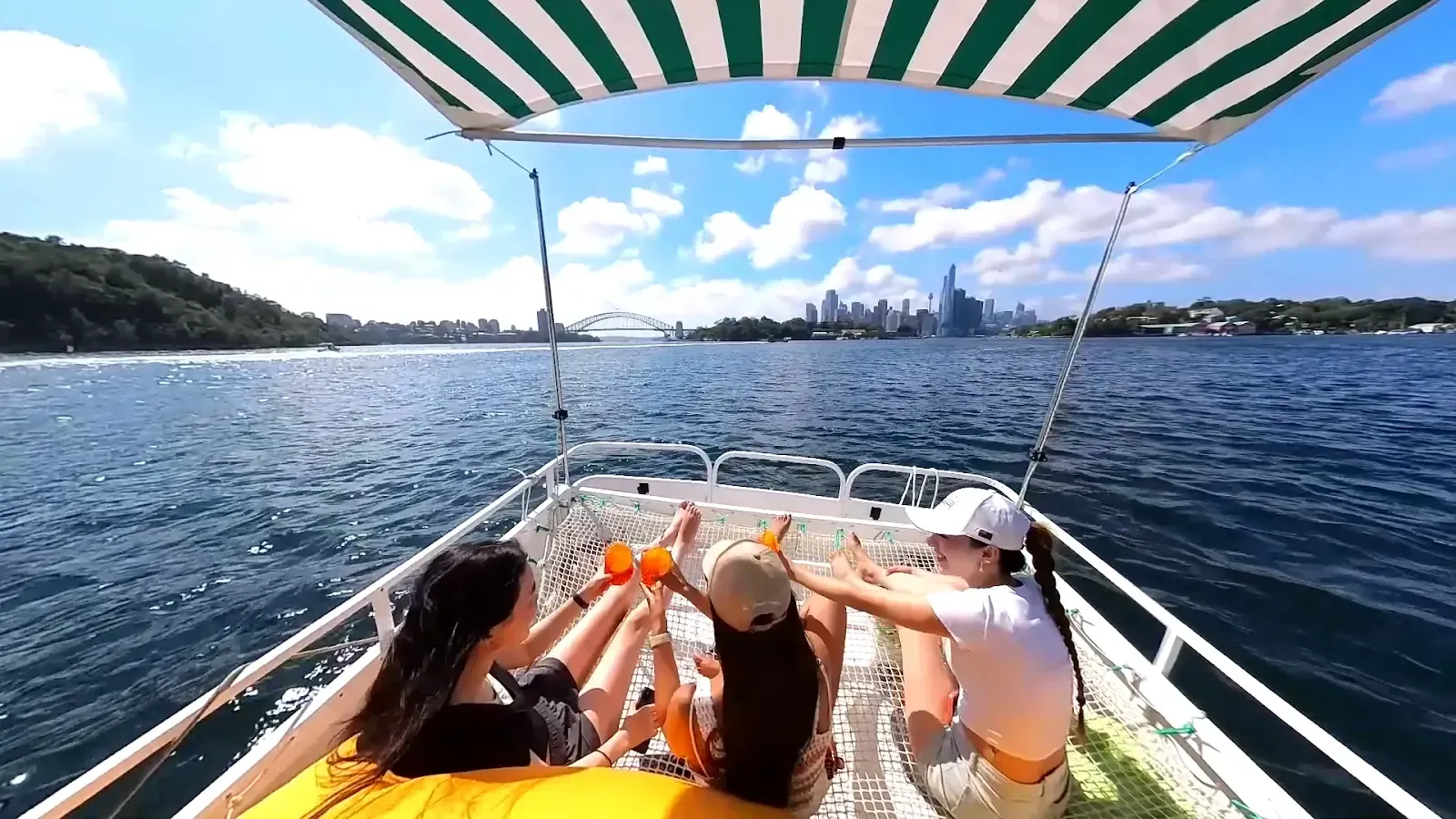 A group of people are sitting on a boat in the water.