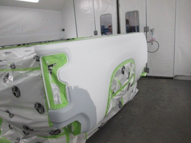 A car is being painted in a paint booth.Auto Body Repair in Colville, WA