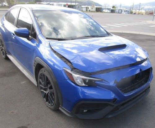 A blue subaru wrx sti is parked in a parking lot. Auto Body Repair in Colville, WA