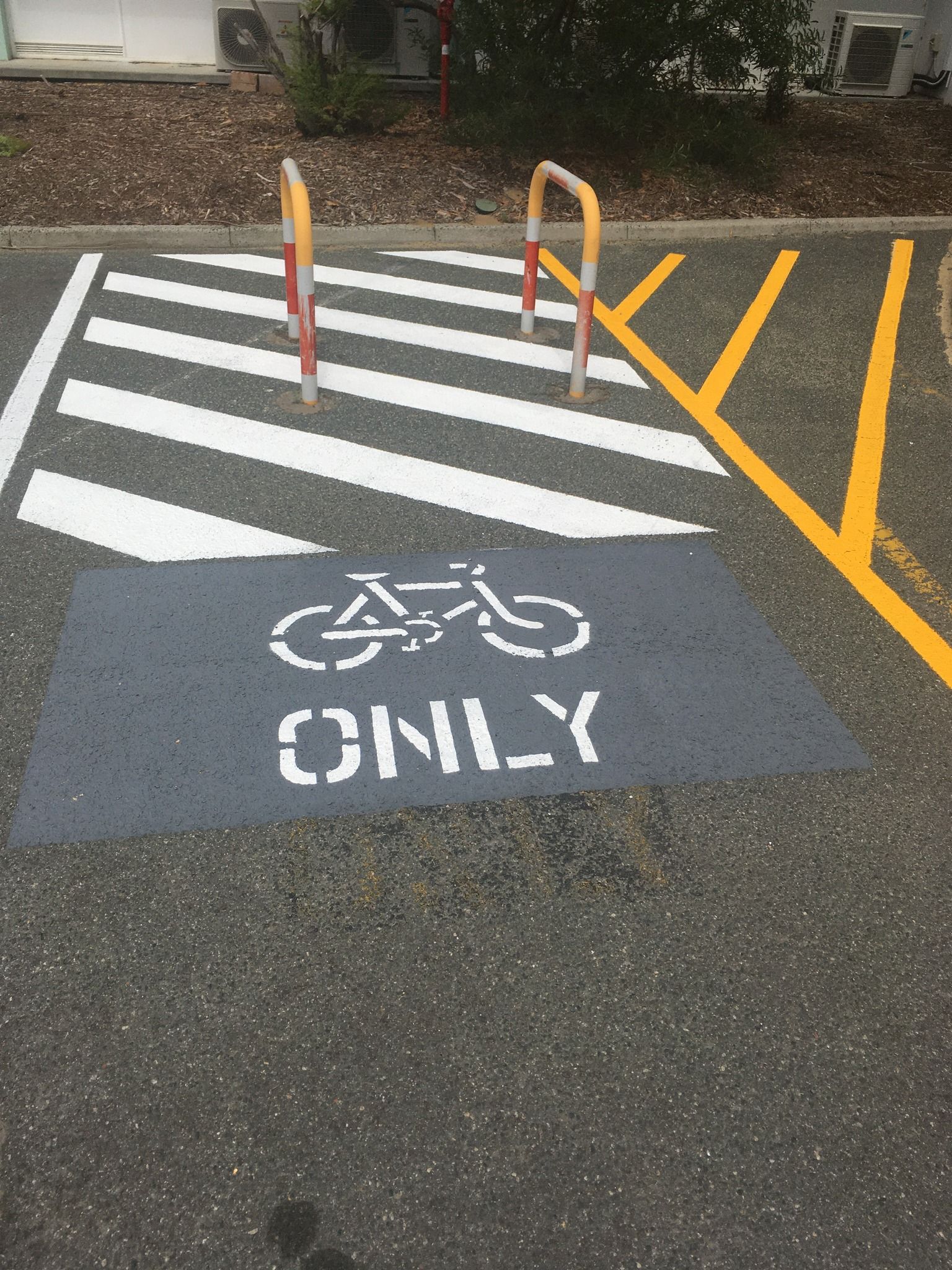 Bike parking space painted with bike symbol and 