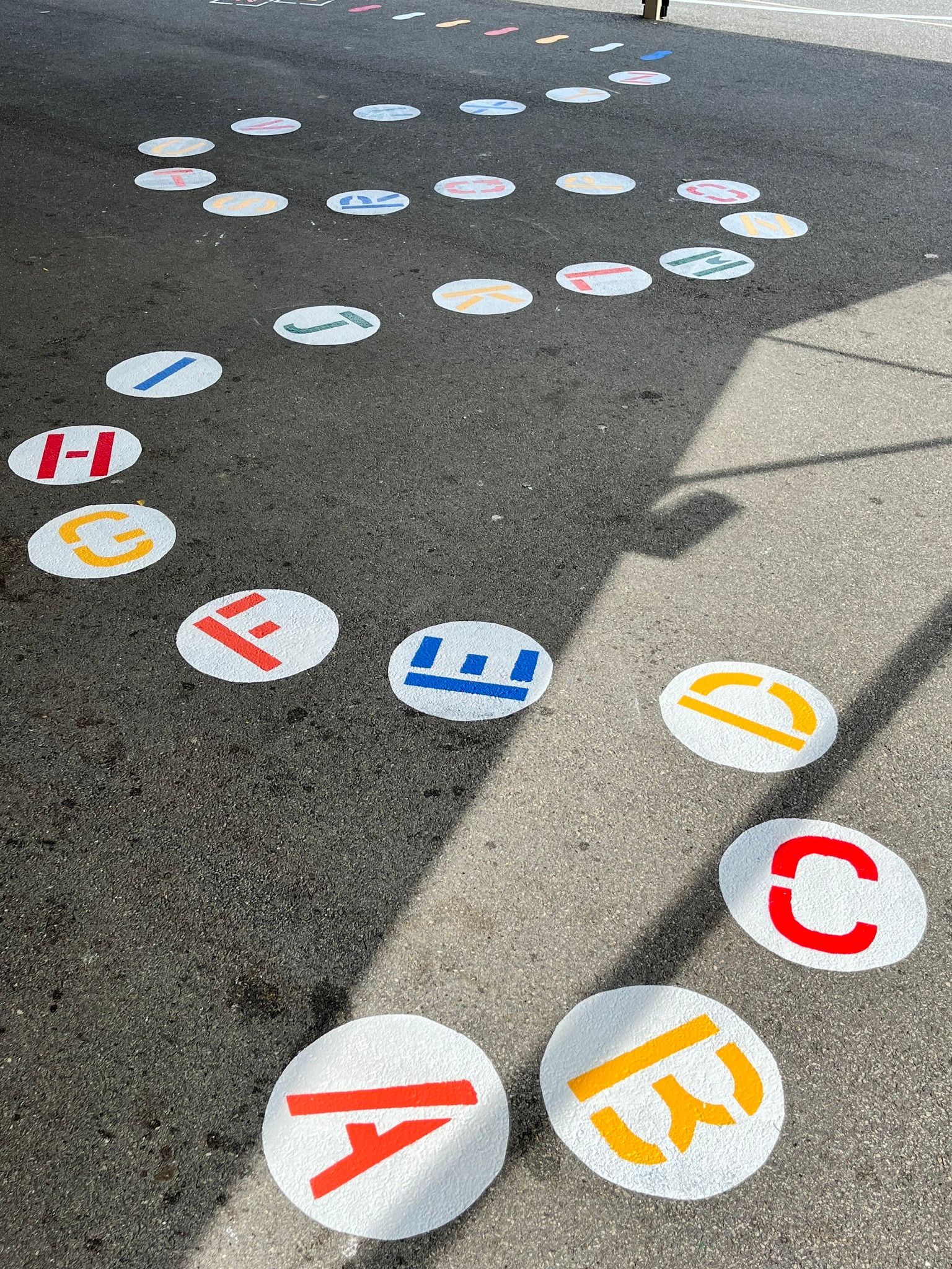 numbered tiles painted on school grounds